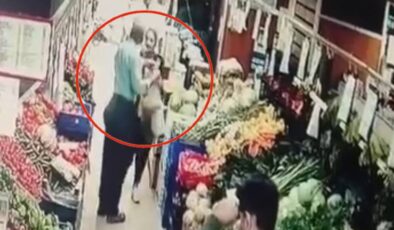 Markette dehşet anları kamerada: Tartıştığı kadına yumruk attı