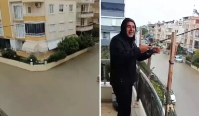 Sokaklar göle döndü ama o balkondan olta attı