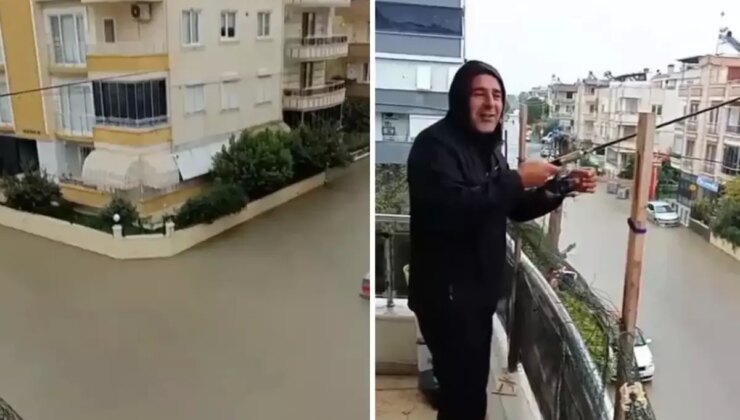 Sokaklar göle döndü ama o balkondan olta attı