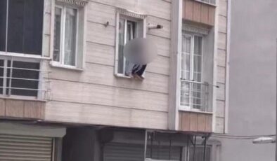 Eve kitlenen genç kadın kendini camdan attı