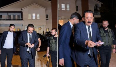 Ertoşi aşiretinin lideri İskender Ertuş aracından iner inmez deste deste para dağıttı